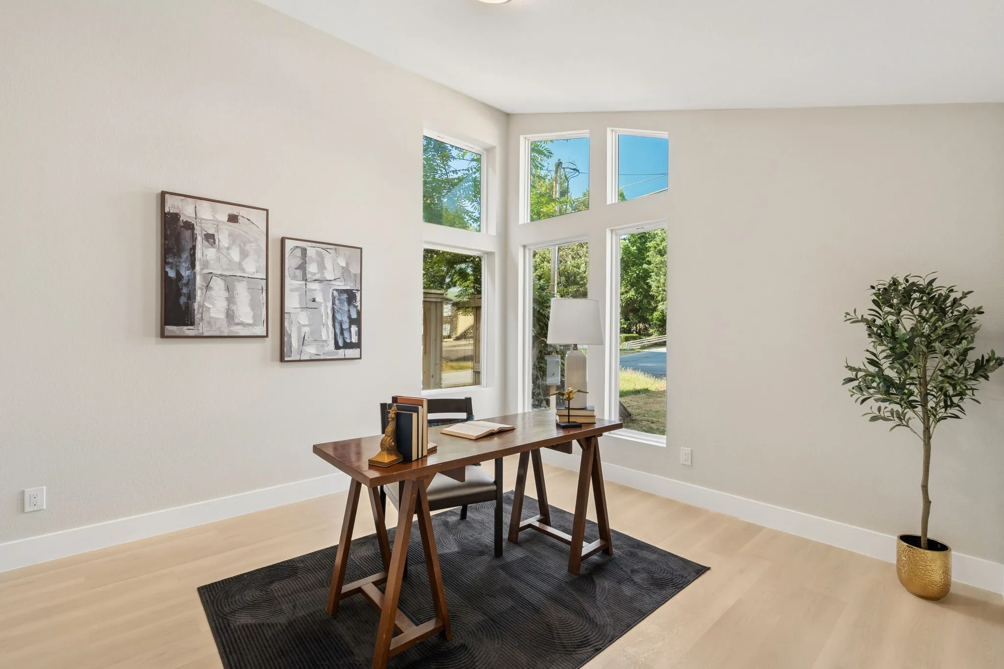 Vaulted ceilings highlight a wall of multi-pane windows