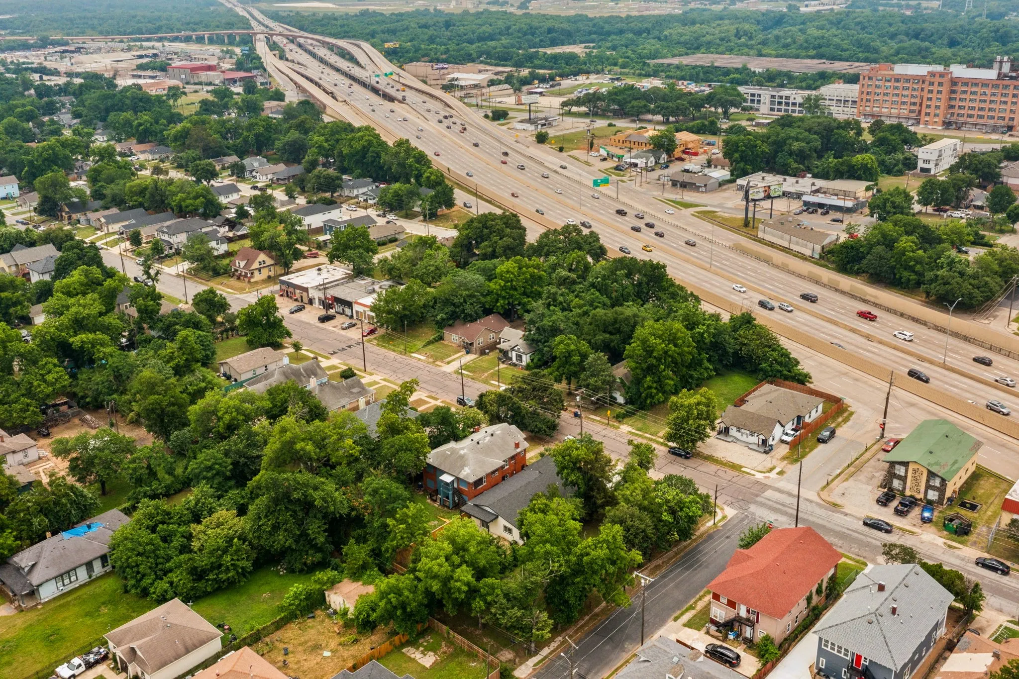 Aerial perspective showcasing a dense residential area with mature trees