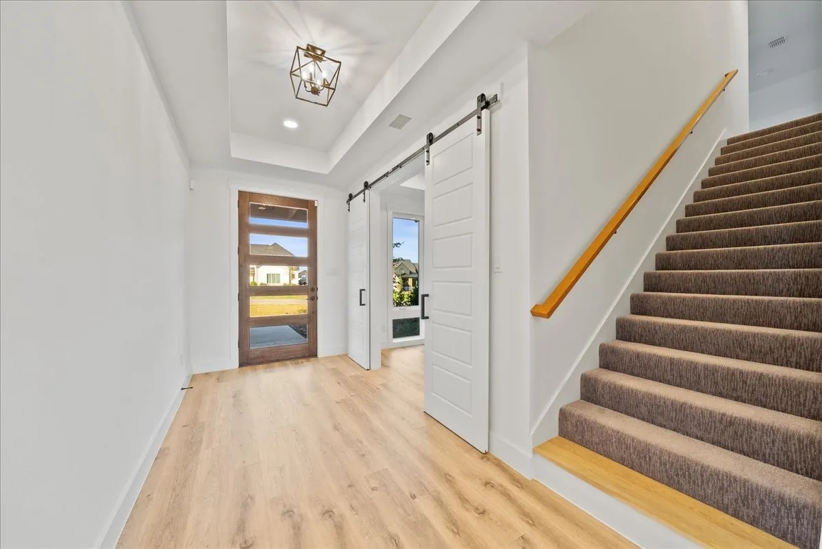 Front Entry with Office, and stairs leading to the Bonus Room with Ensuite Full Bath