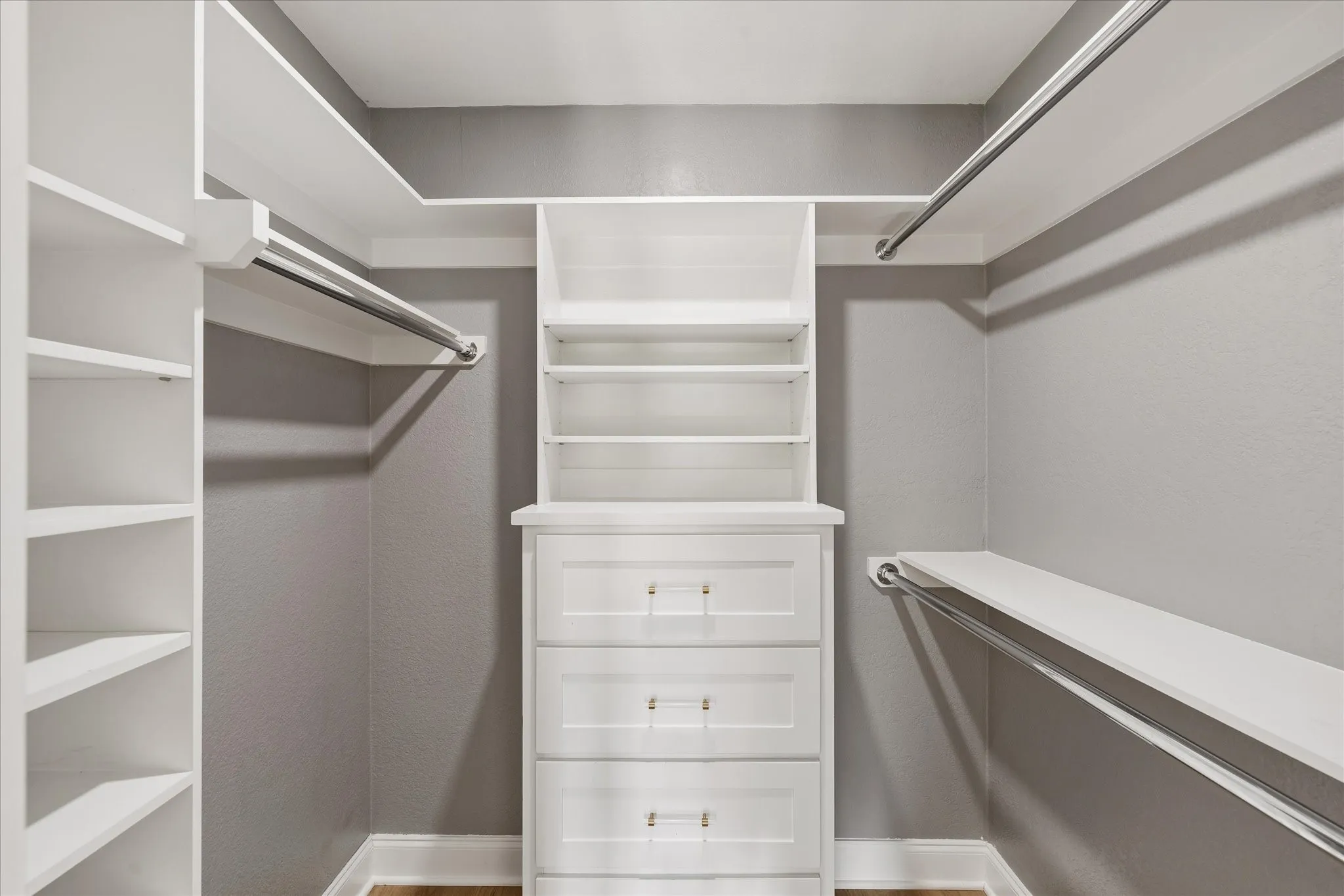 One of two Primary walk-in closets