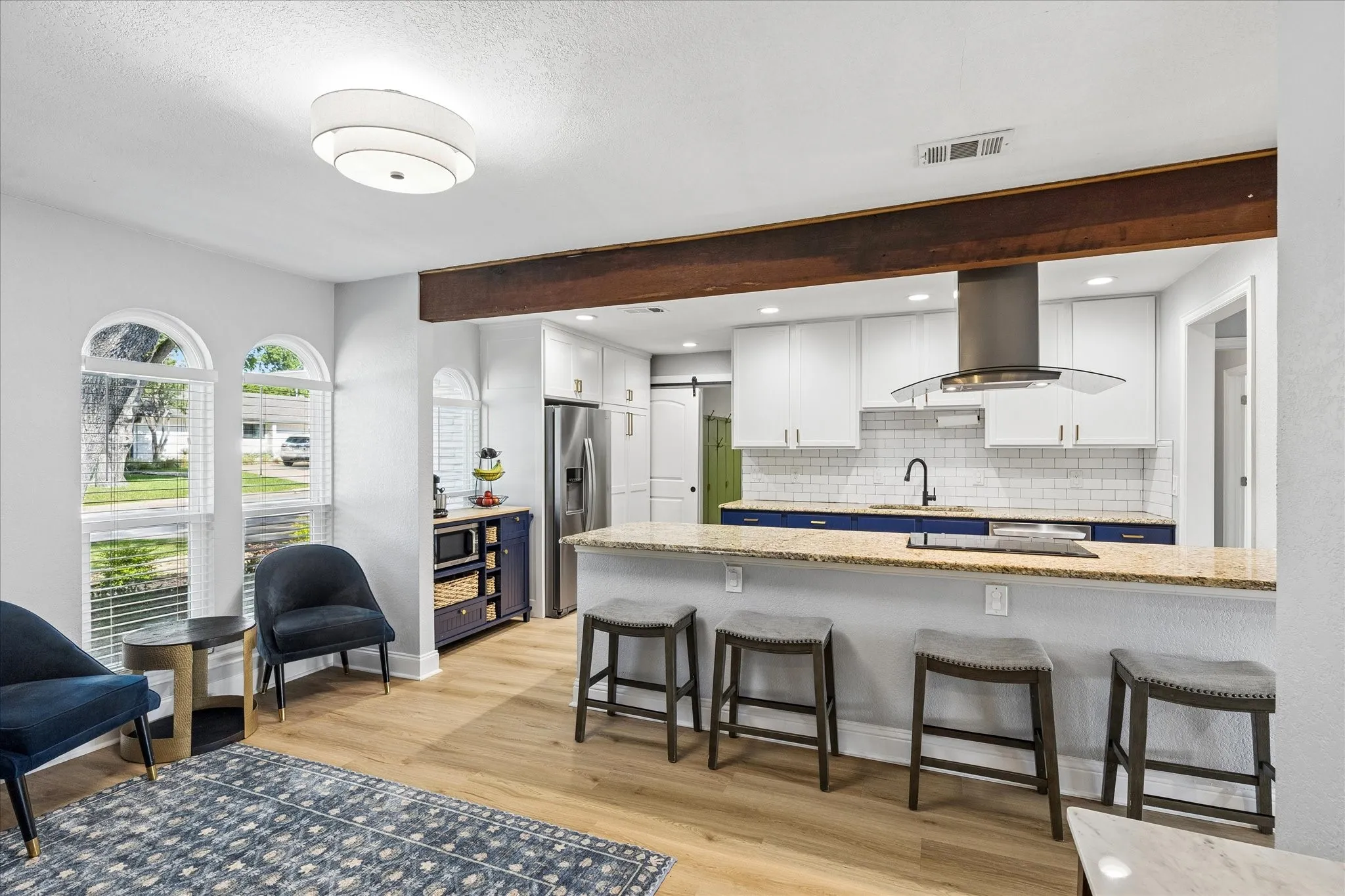 Breakfast bar with room for four! Staged prior to new countertops.