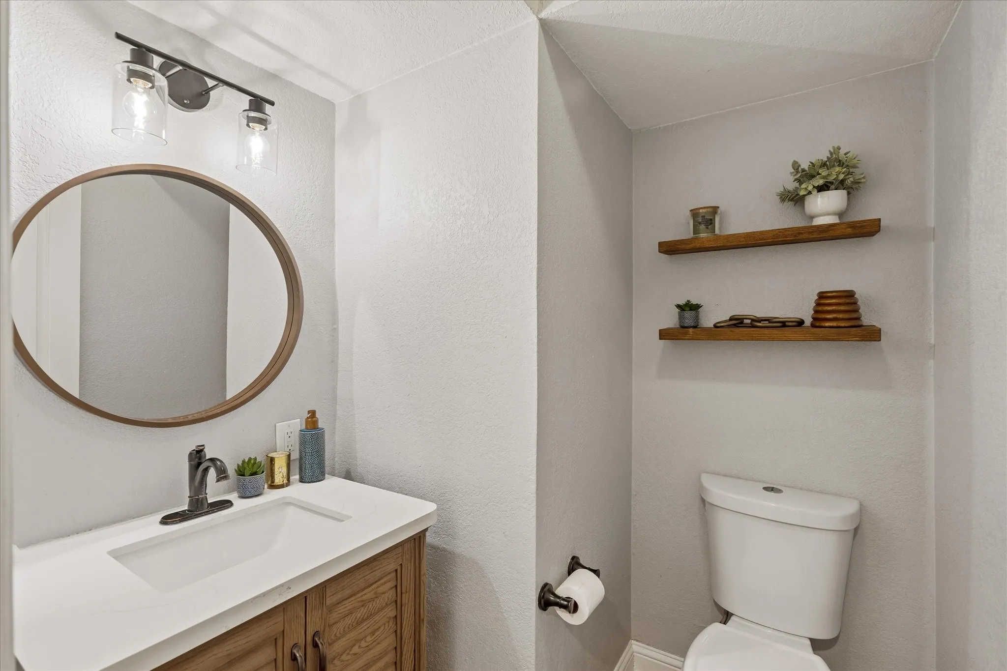 Powder room near kitchen and utility room