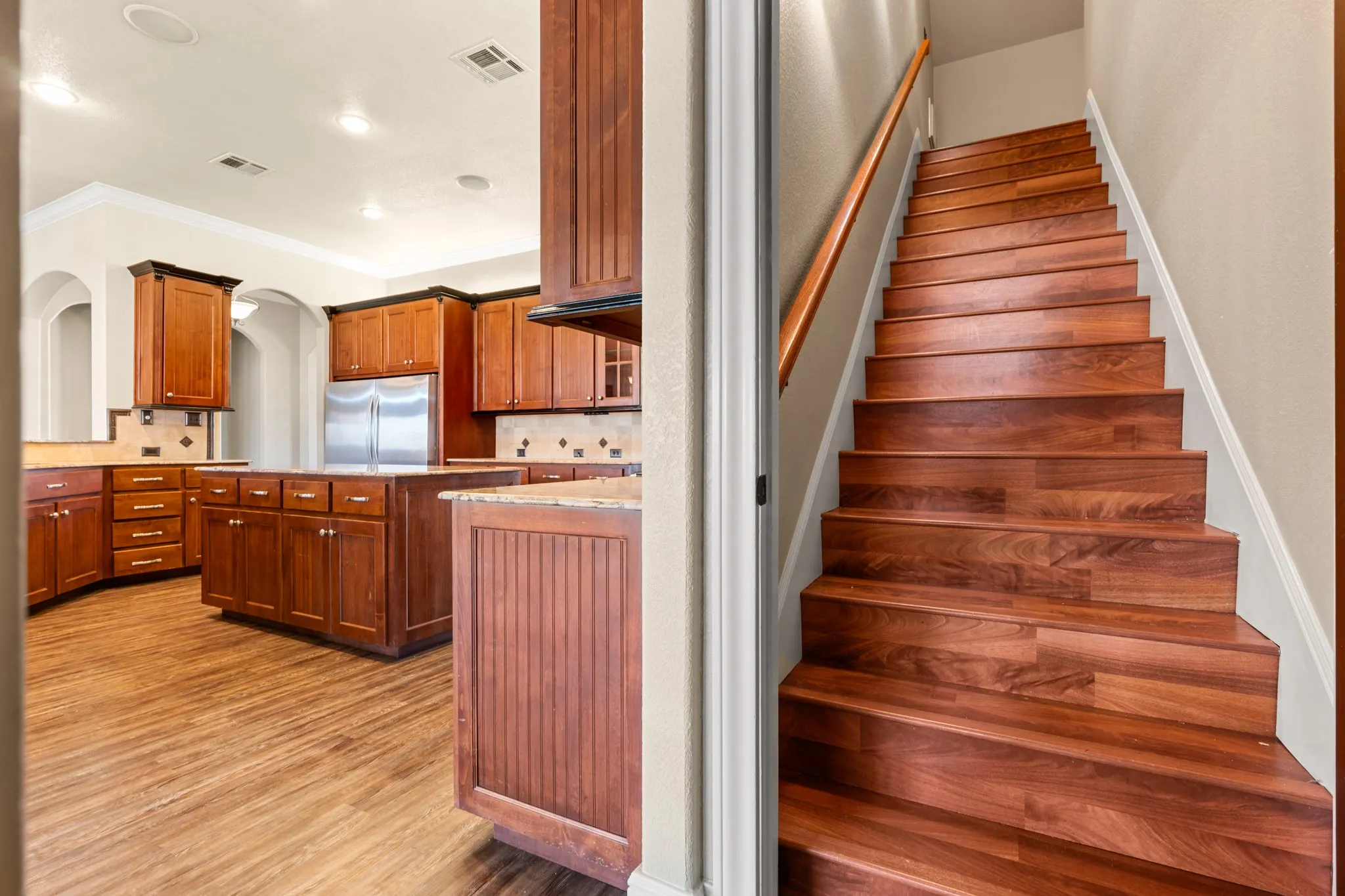 Stairs leading up to the 2nd floor 5th bedroom or media room.  closets in media room.