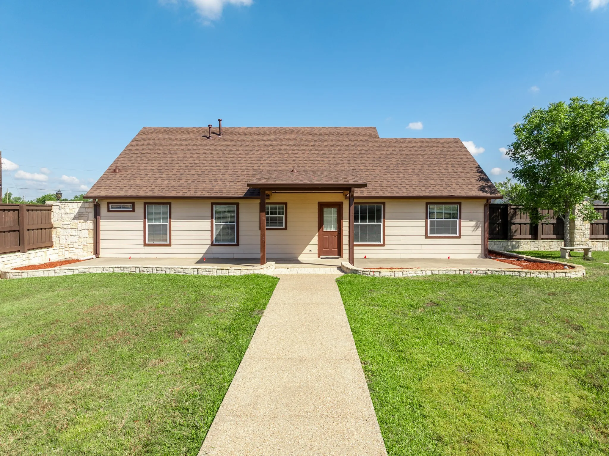 Back of Residence 2 access via courtyard area.  1158 sq. ft.  3 bed, 2 ba, 2 car garage.