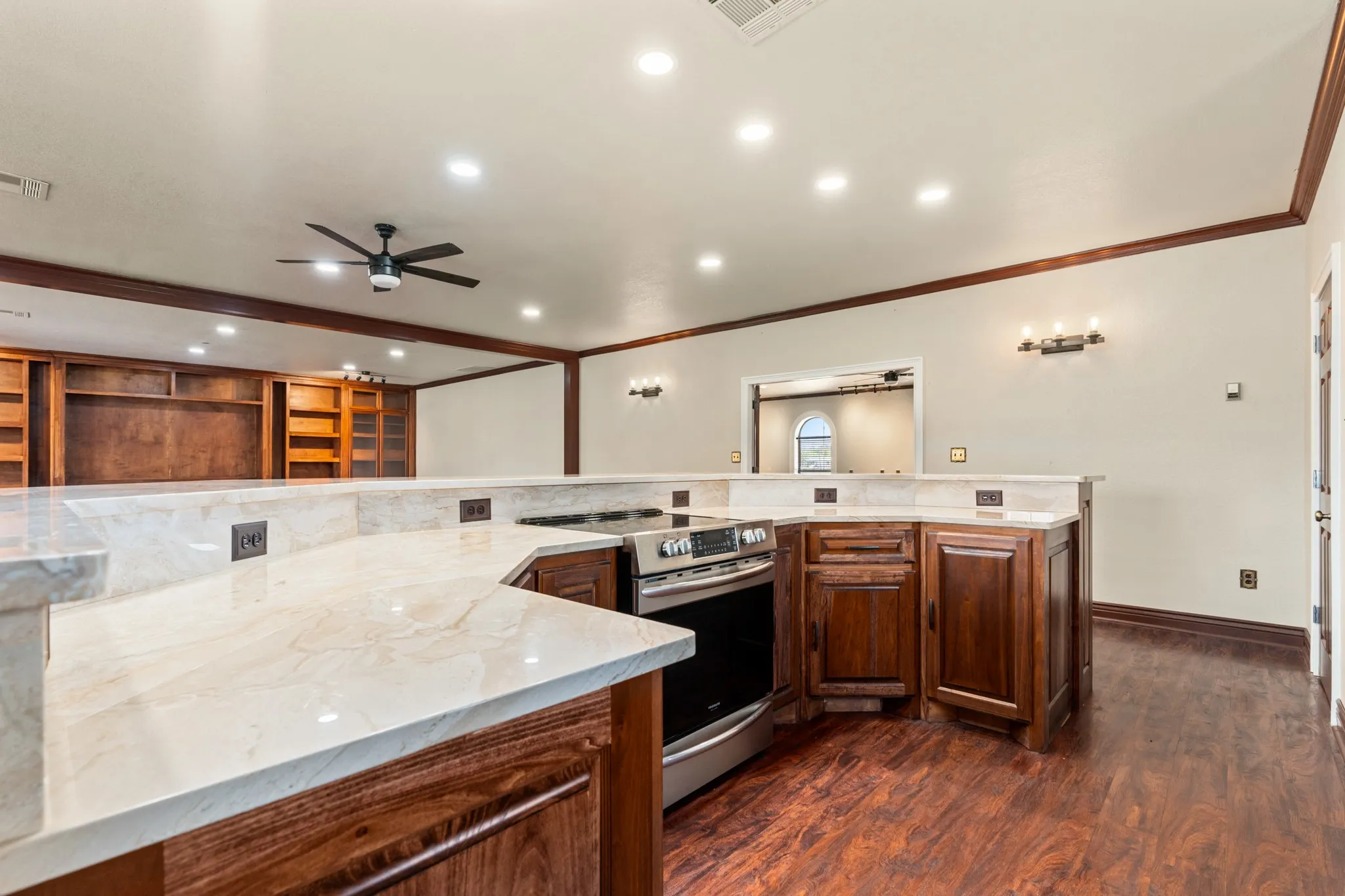 Event house kitchen and bar area with sink and stove.  Built in area for wine coolers.