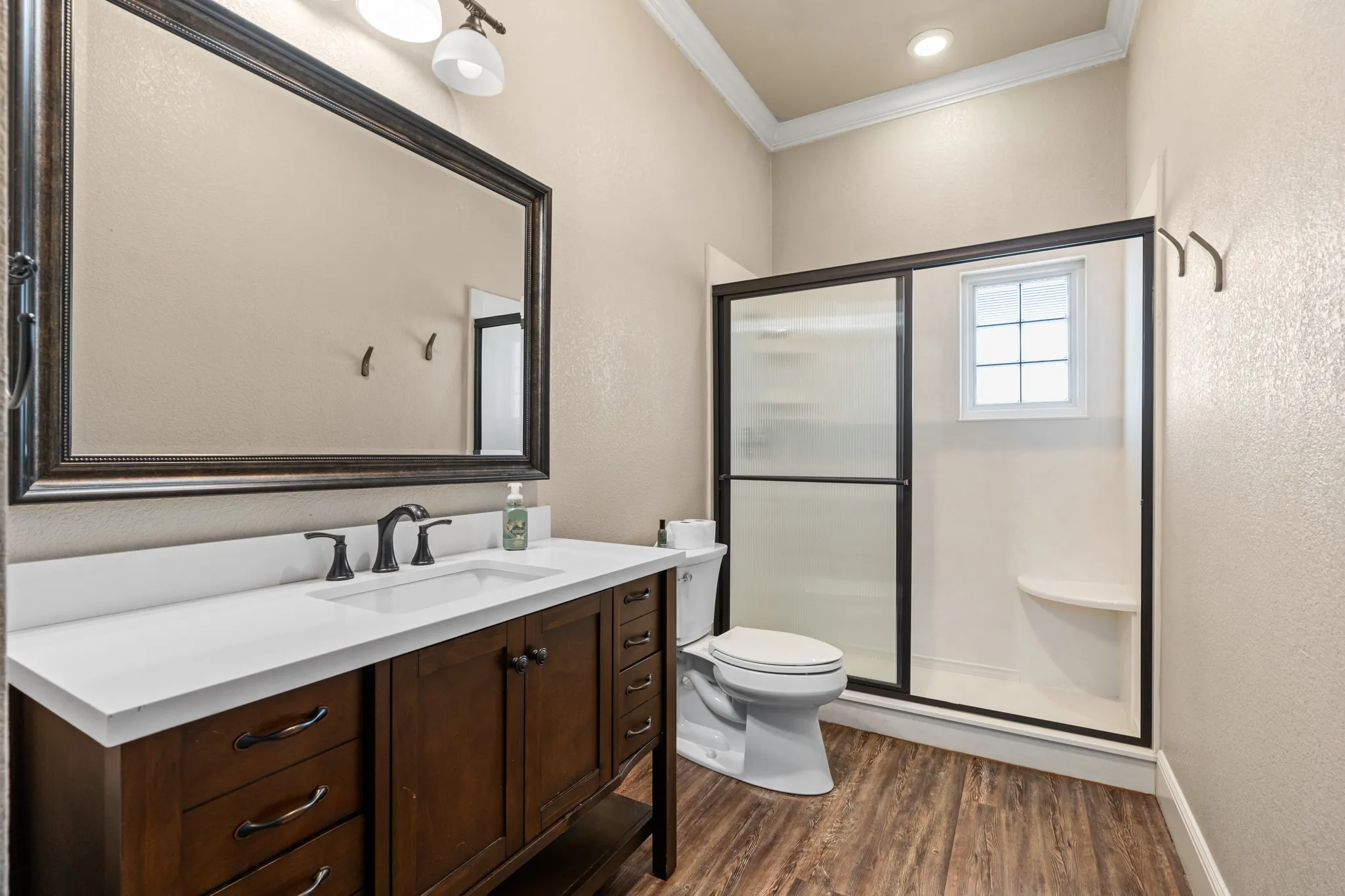 Bathroom near garage and kitchen and laundry room.  Main home.