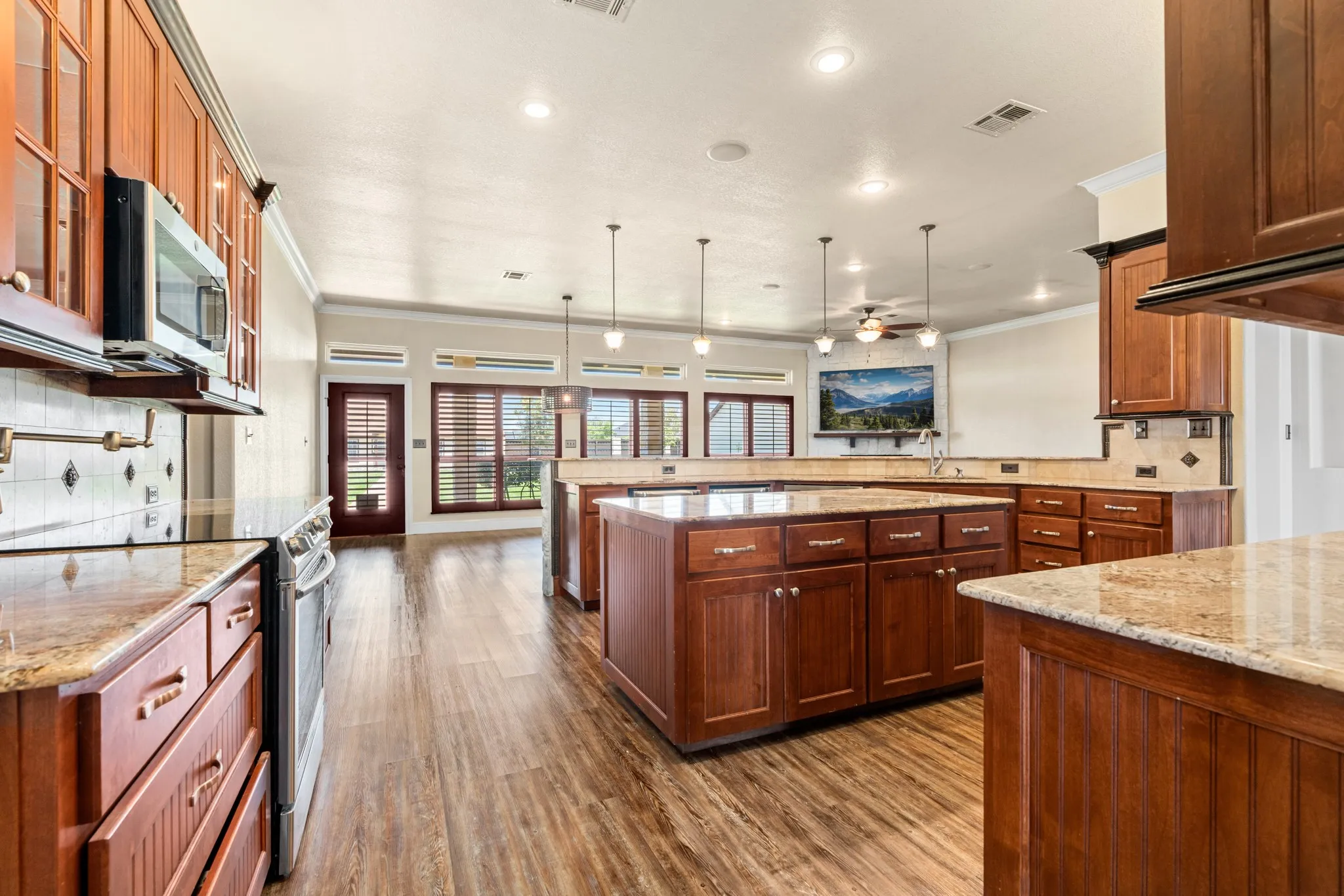 Kitchen featuring 2 wine coolers and stainless appliances.