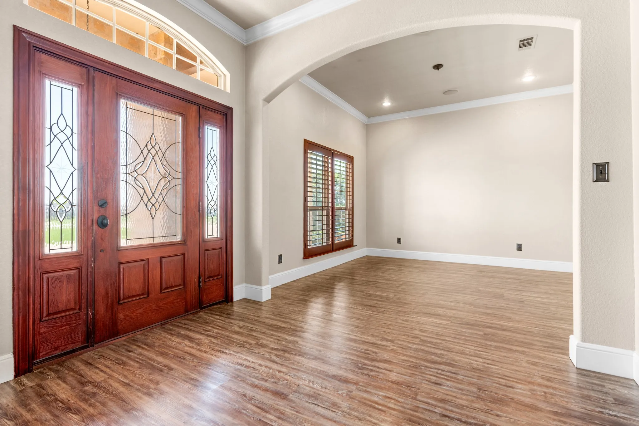 Entry way and formal dining or flex space.