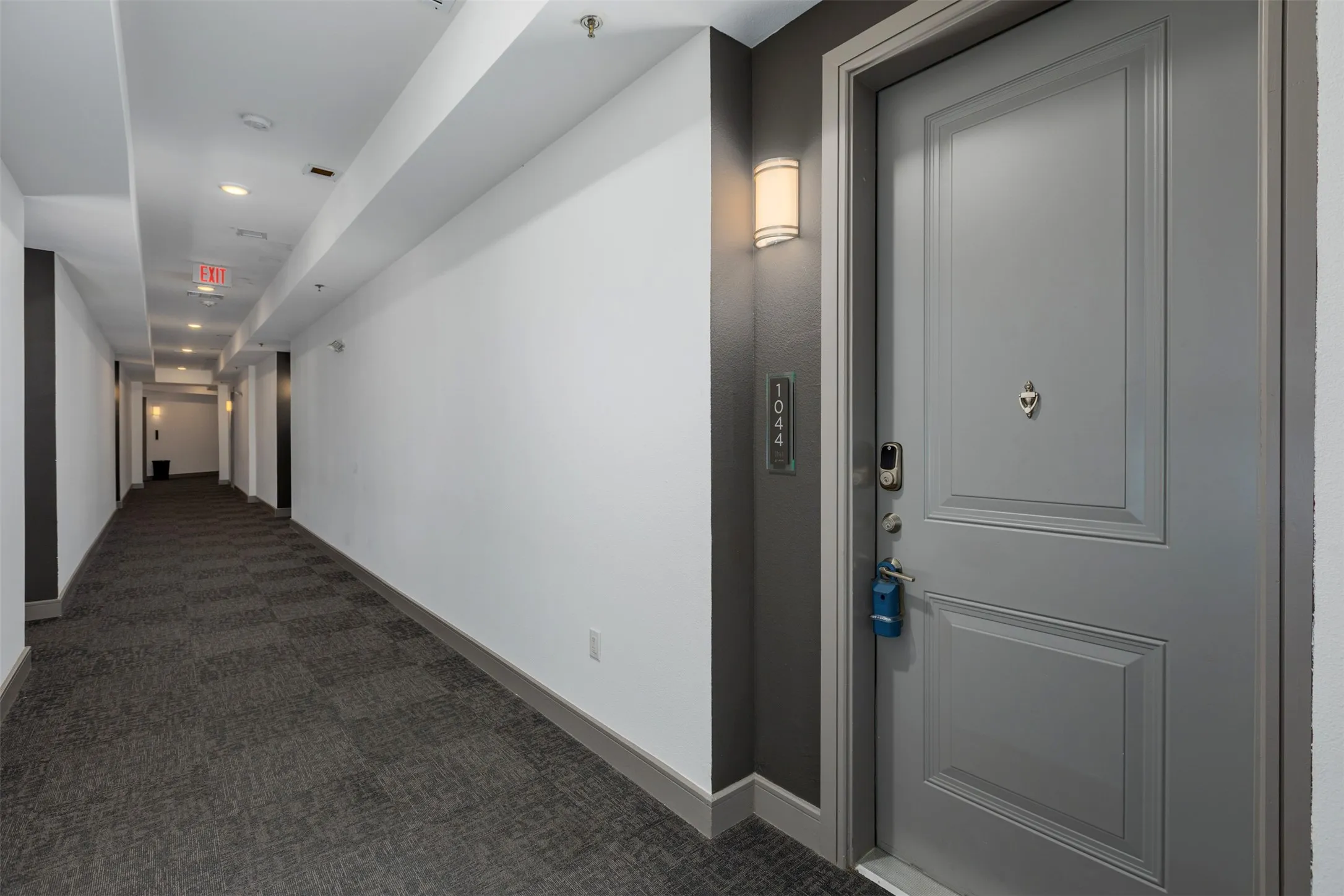 Entry door featuring panel detailing and a digital lock system