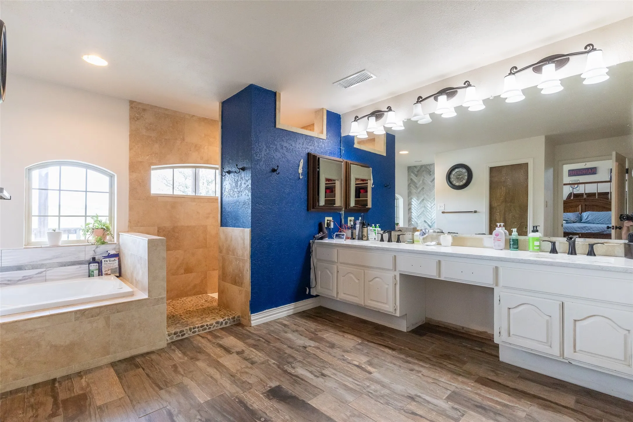 This primary bathroom is massive with separate tuba and shower, and an oversized primary closet