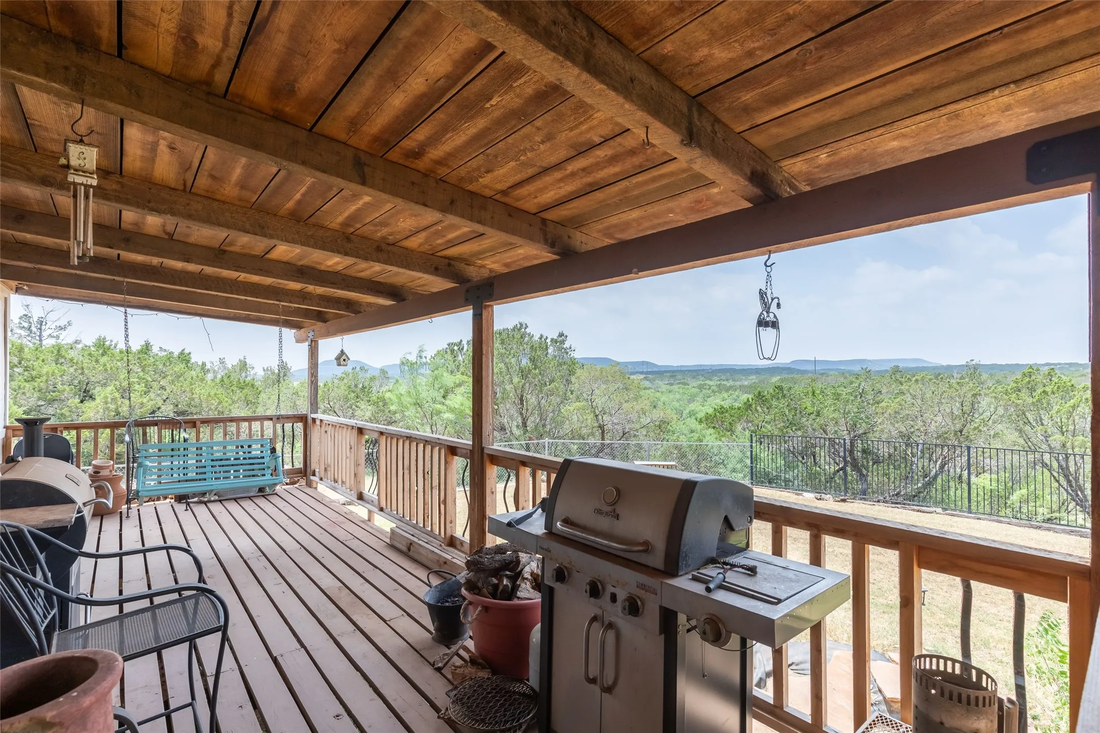 Mid level deck is huge and has a great view. Access to the kitchen and is perfect for outdoor cooking and relaxing or entertaining.