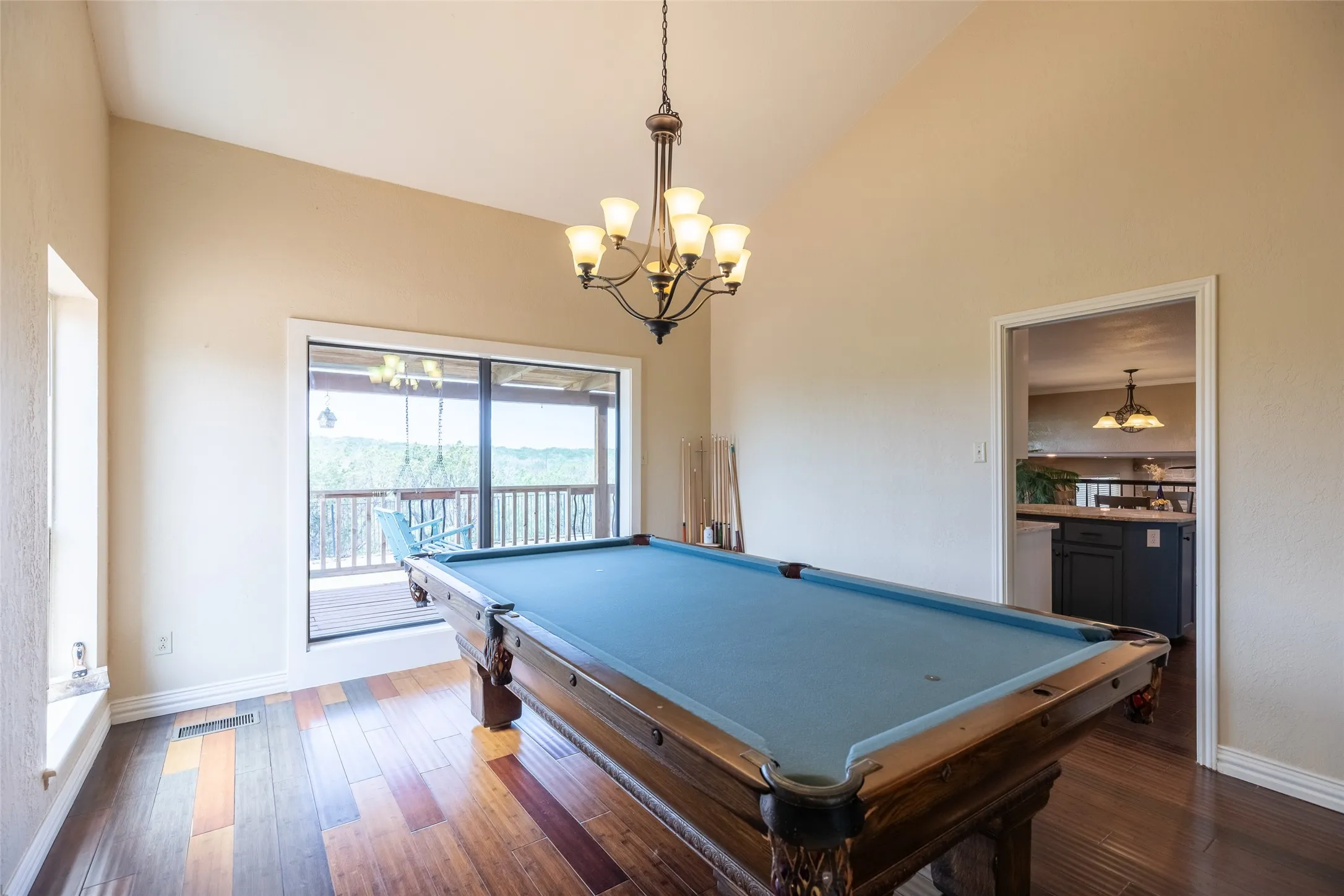 Dining room currently used for this full sized pool table. Natrual light and a view to the back of the property.
