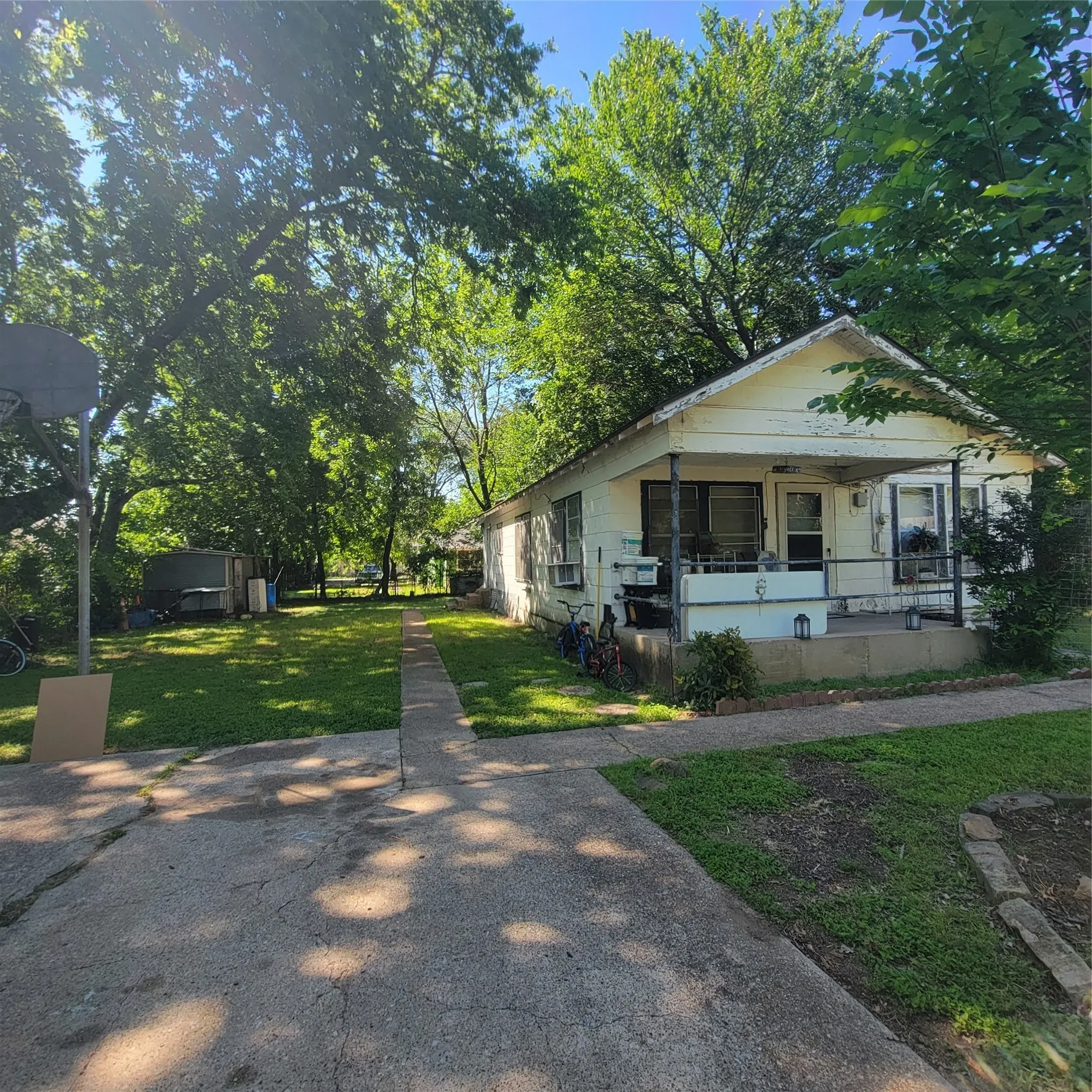 Single-story residence featuring a covered front porch with railings