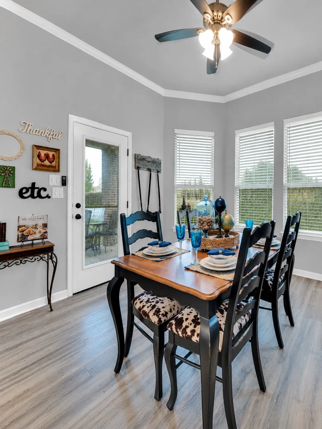 Dining area with a charming bay window and easy access to the patio.