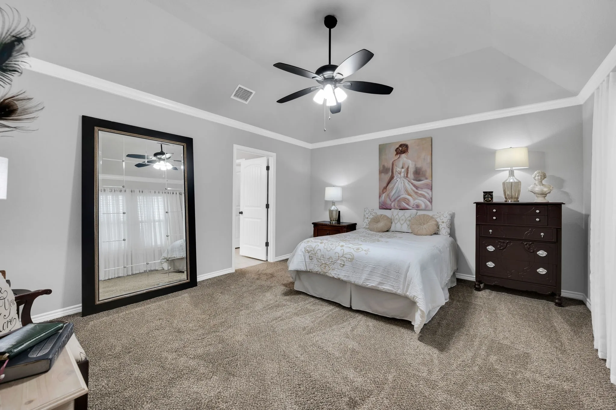 Primary bedroom with direct access to the en-suite bath and closet.