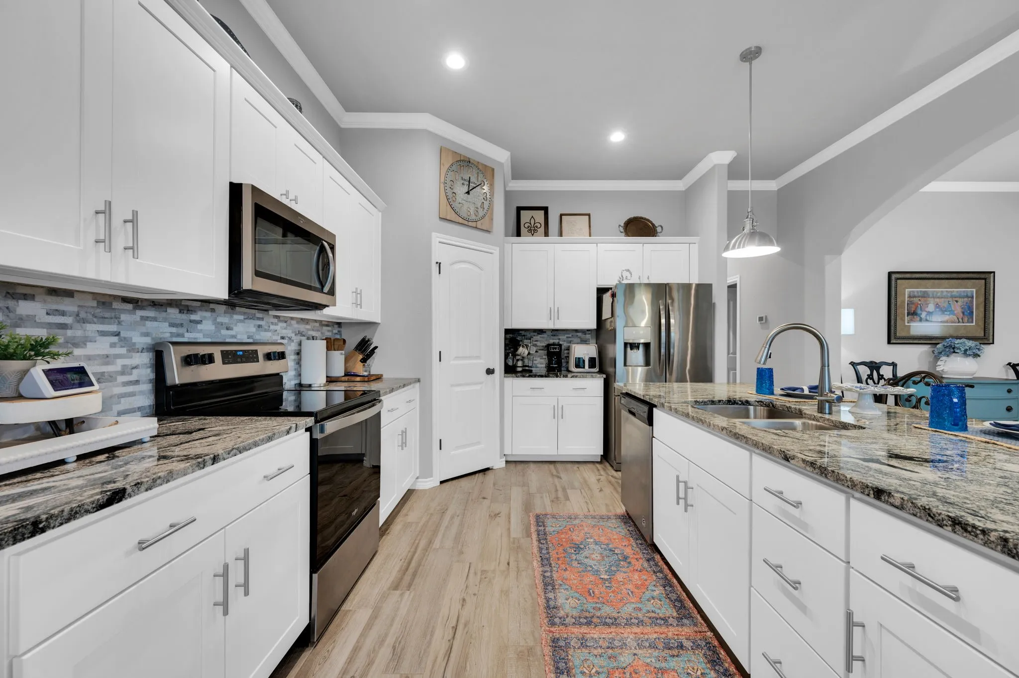Well-appointed kitchen with granite countertops and abundant cabinet space.