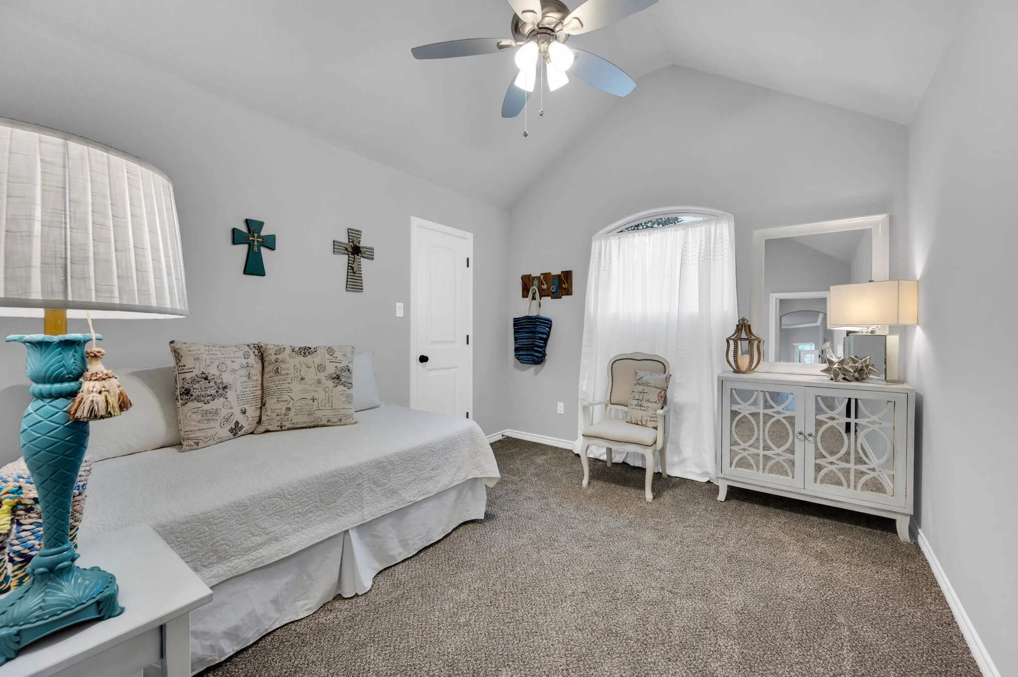 Third bedroom with a vaulted ceiling, offering a versatile space for family or guests.