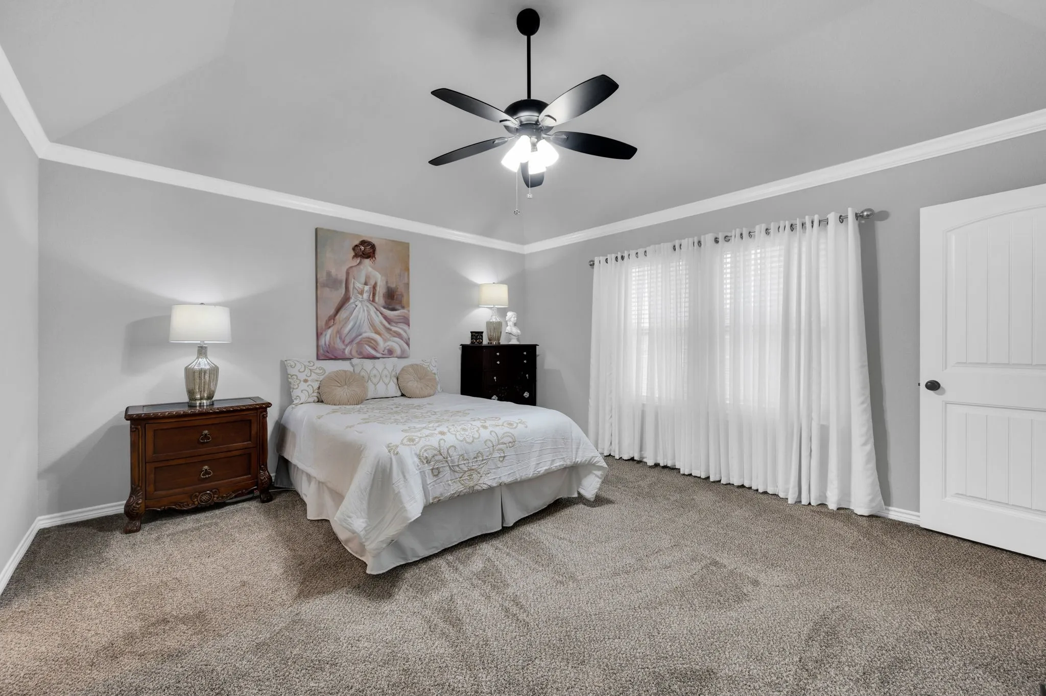 Spacious primary bedroom offering a peaceful retreat at the end of the day.