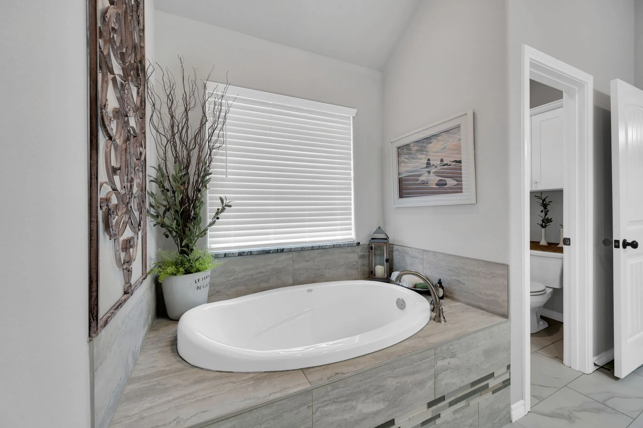 Primary bath with a deep soaking tub, a perfect place to unwind after a long day.