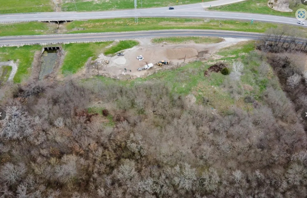 Expansive undeveloped land parcel featuring significant tree coverage