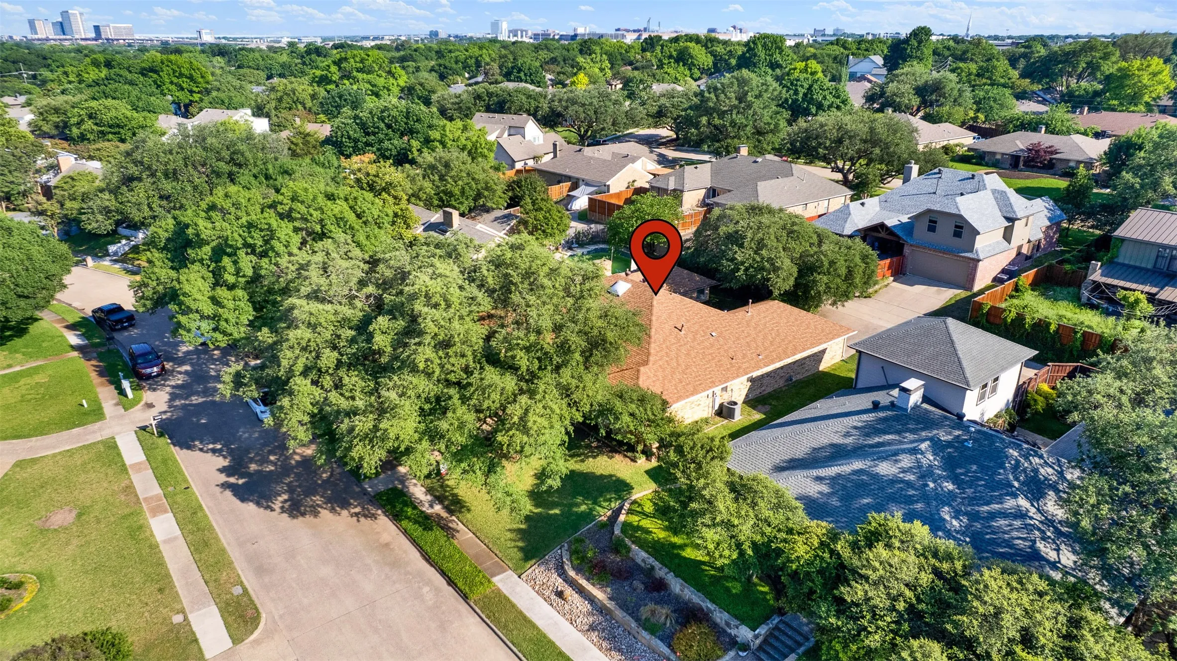 Arial view showing quiet street and mature trees