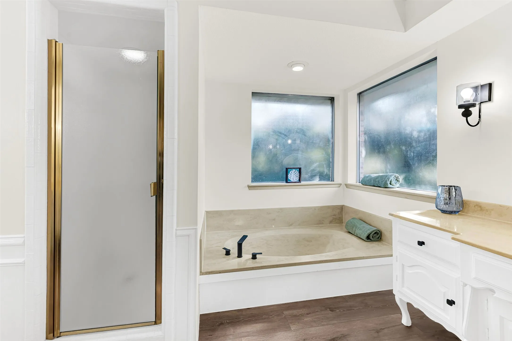 Updated primary bathroom, with bathroom friendly flooring just installed.