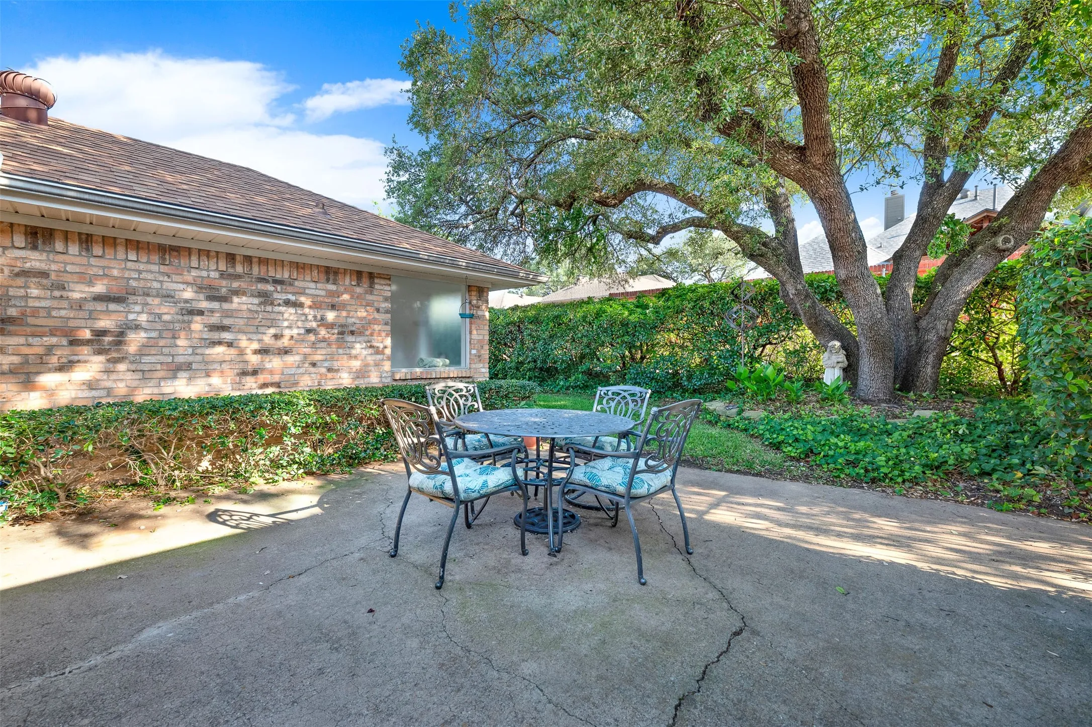 Back patio with large patio area for entertaining, mature trees and lots of natural greenery