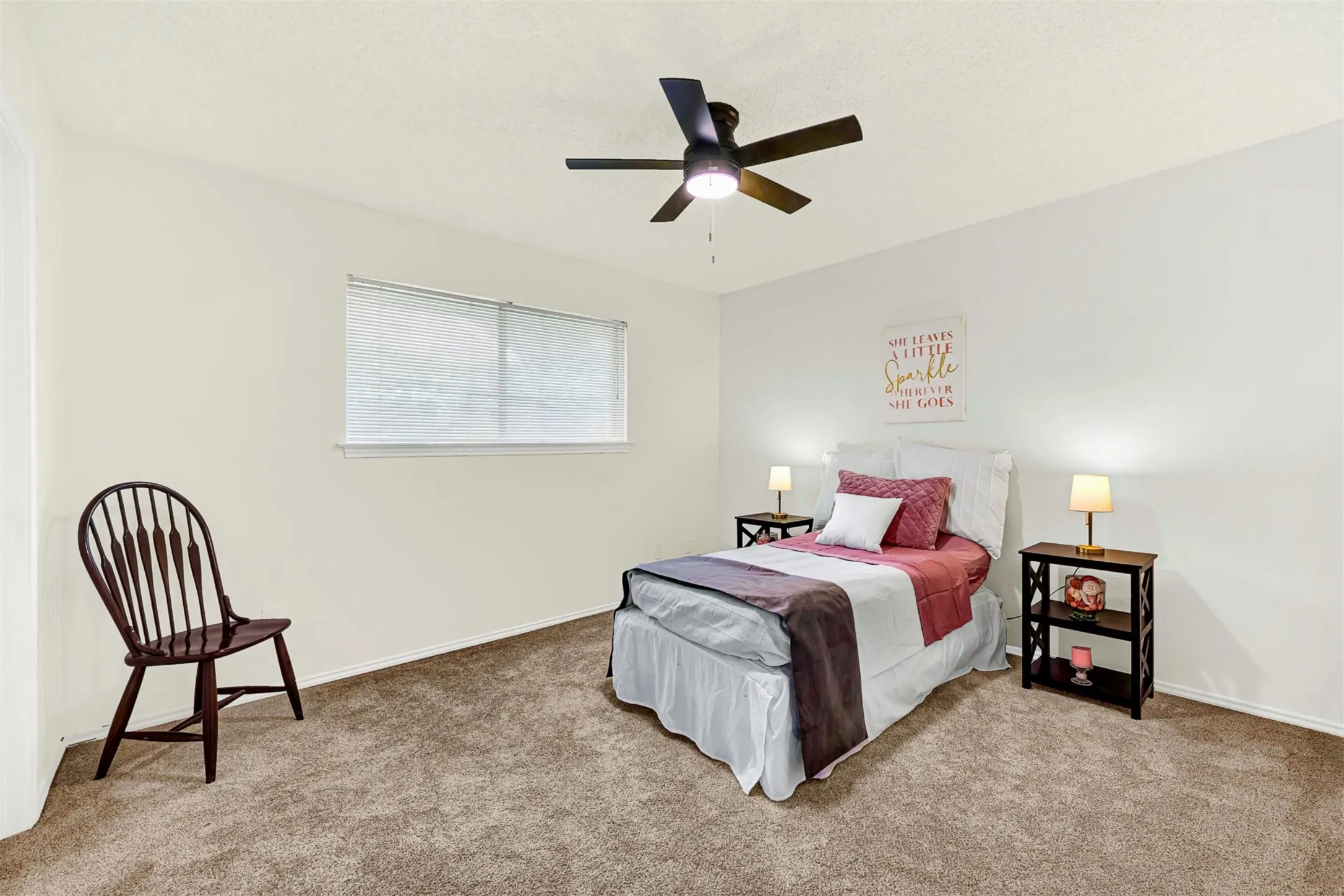 Middle bedroom, with large window for natural light.