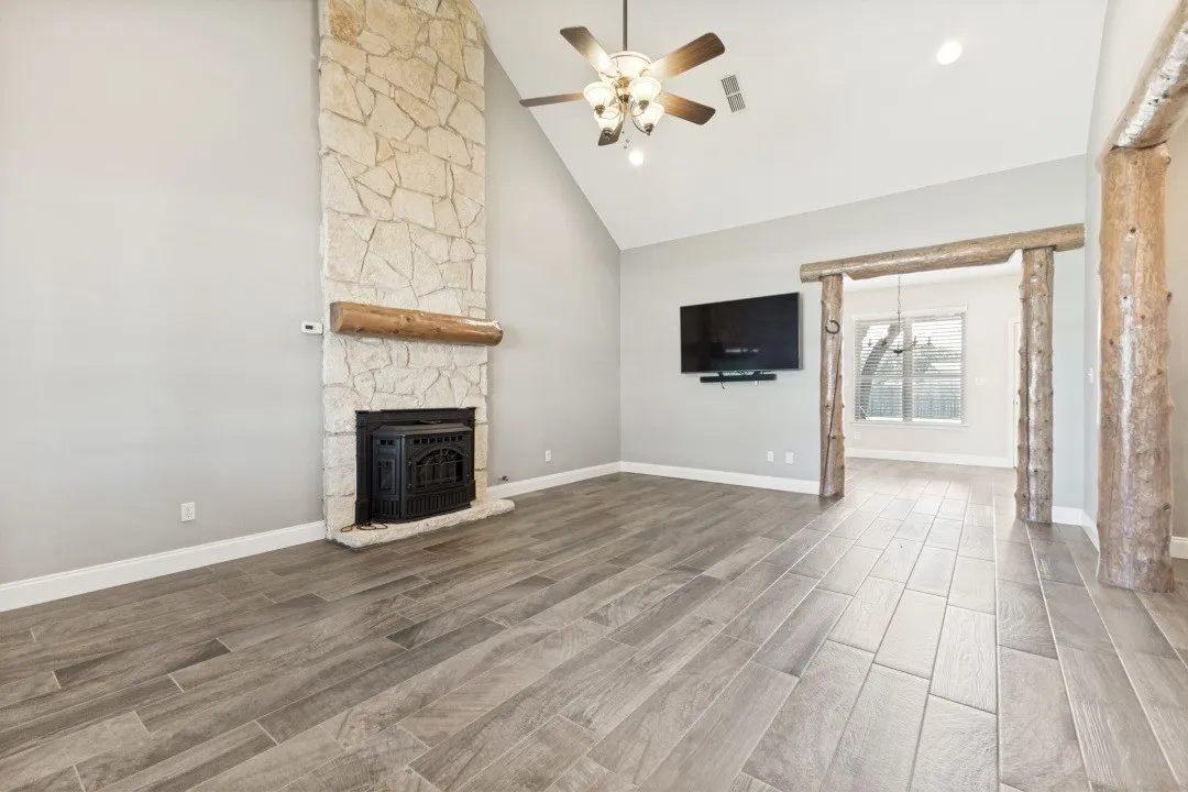 Soaring Vaulted Ceilings, Stone Fireplace with Thermostat controlled Wood Pellet Stove.