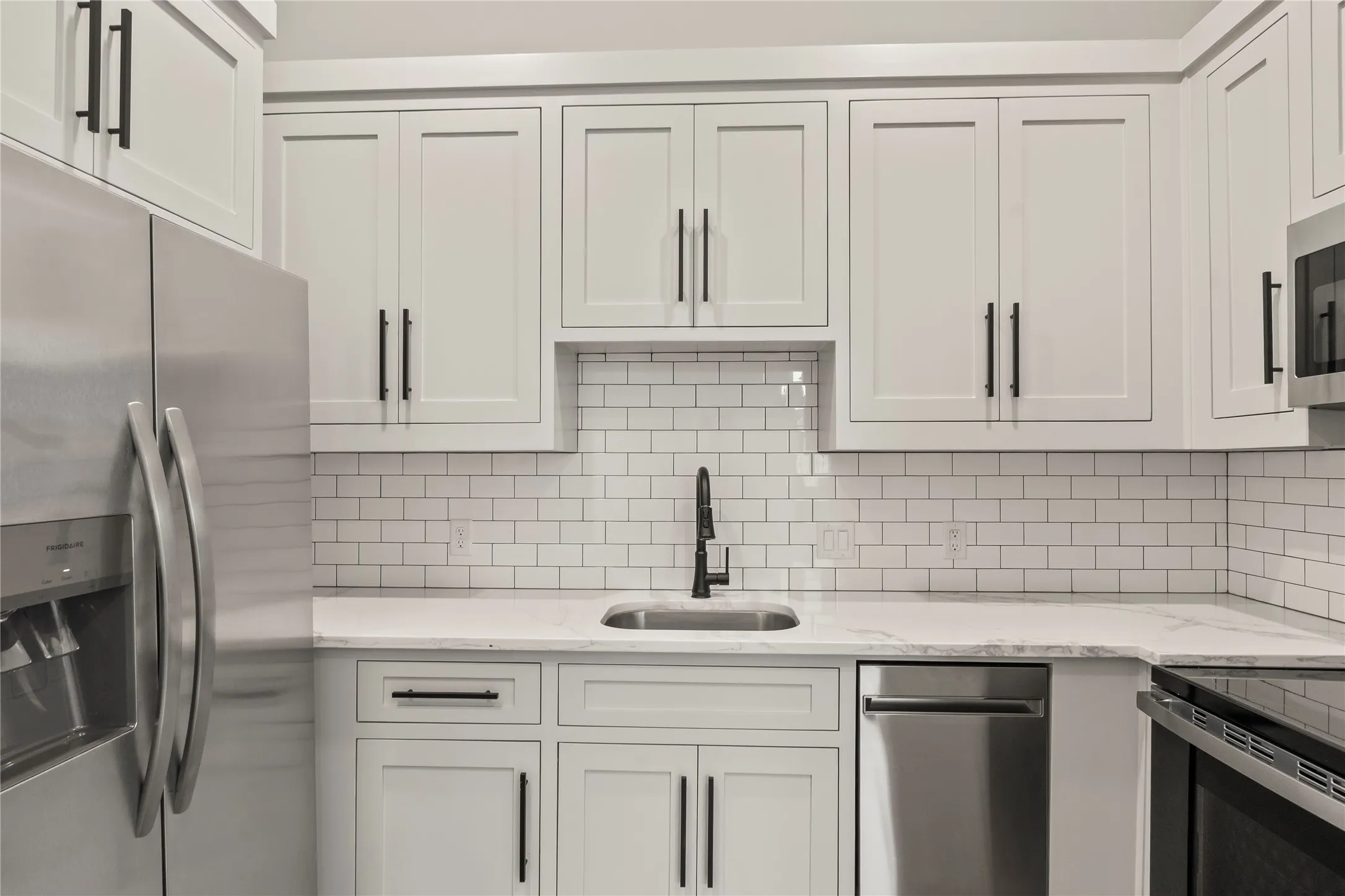 Guest Quarters Full Sized Kitchen w/ Full Appliance Package including dishwasher and stackable wash/dryer