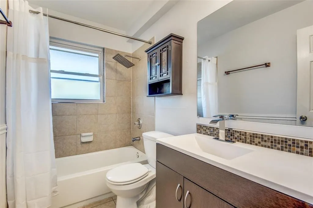 Additional photo of Bathroom - shower tub combo, and a mosaic tile backsplash