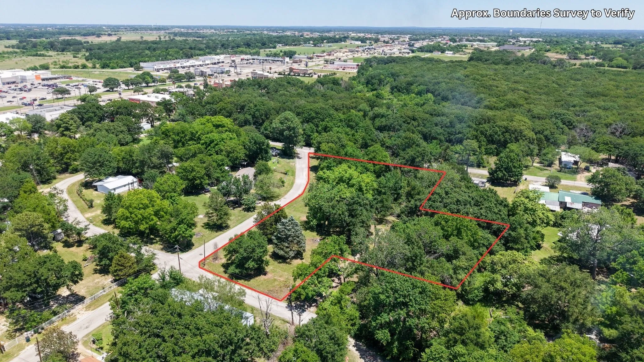 Prime package of six adjoining lots presented as one offering, highlighted here from above to show full property footprint and access.