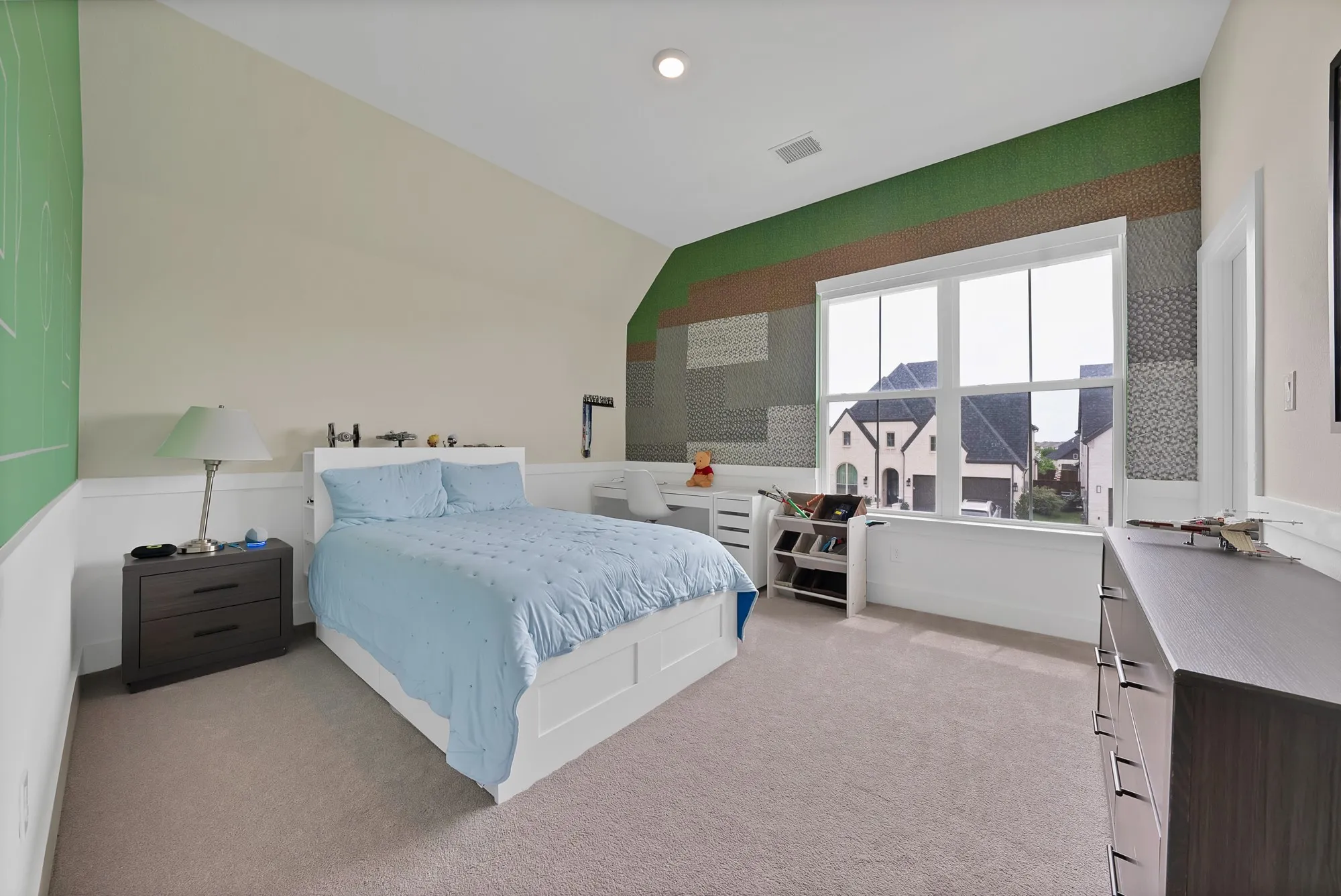Upstairs bedroom with a walk-in closet.