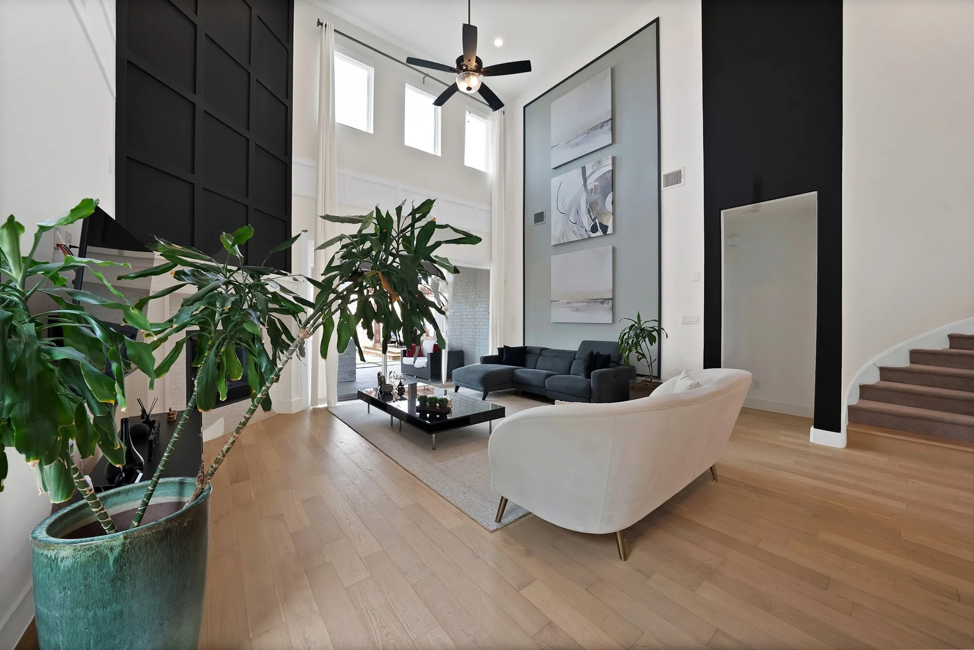 Beautiful accent walls and motorized shades on the upper windows.