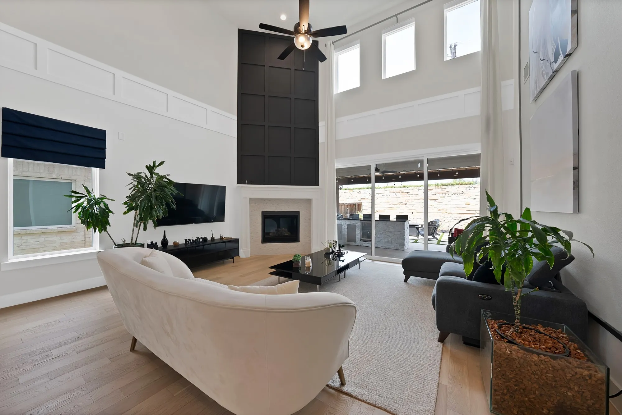 Designed for those who appreciate attention to detail, this home exudes sophistication with beautifully crafted accent walls and an open floor plan accentuated by breathtaking two-story ceilings in the living area.