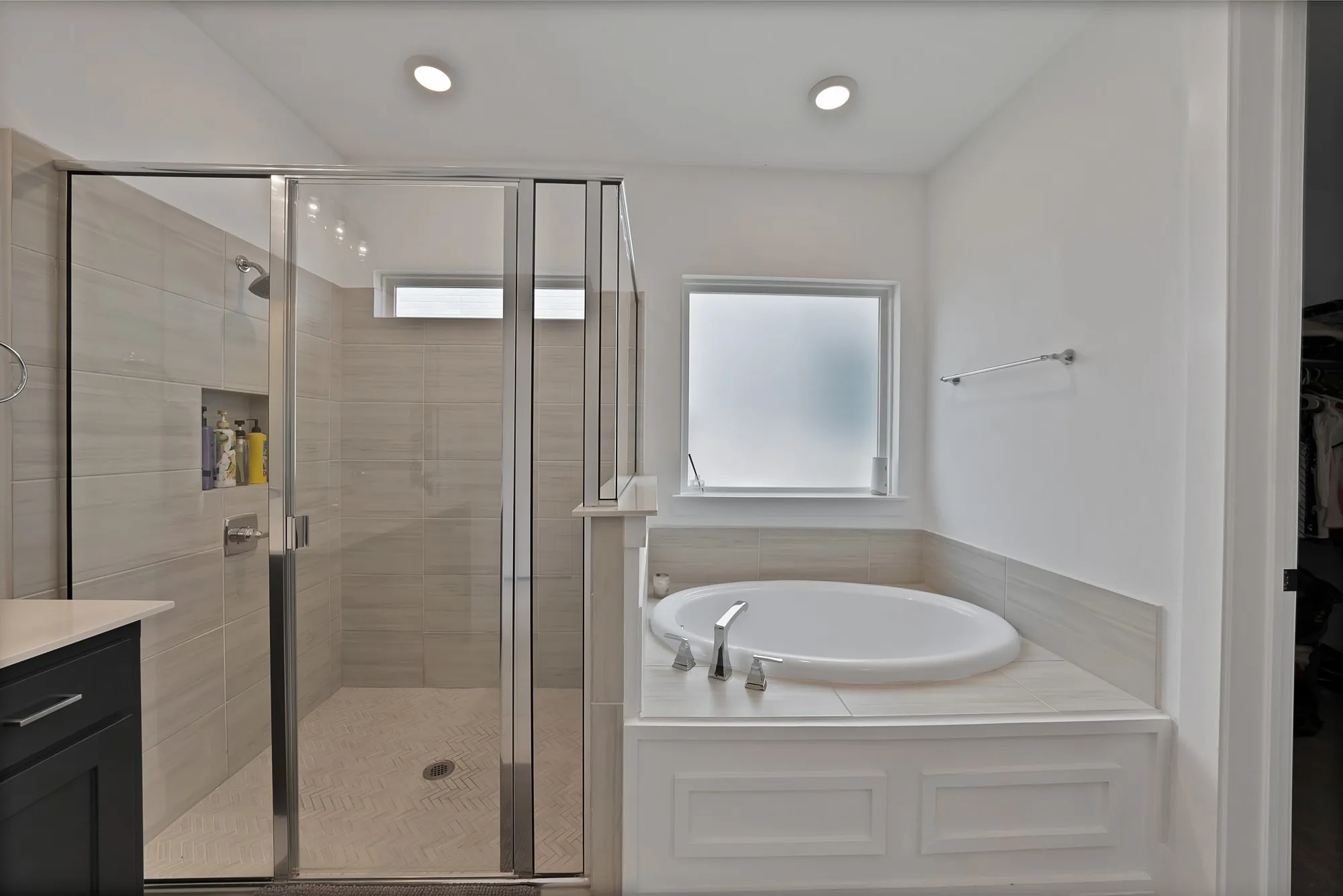 Oversized shower and a separate deep soaking tub.