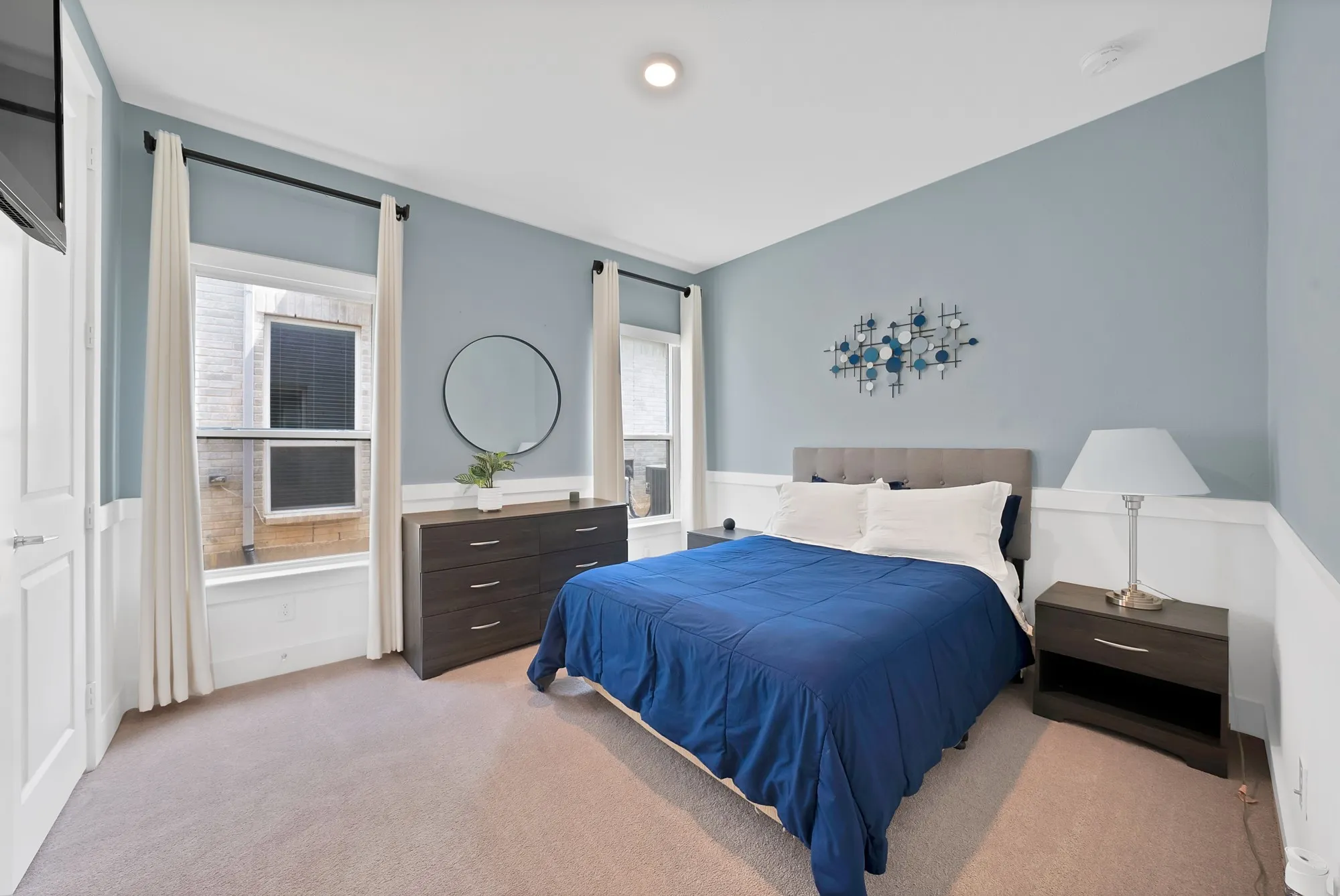 The guest suite is privately located on the main level and features a walk-in closet.
