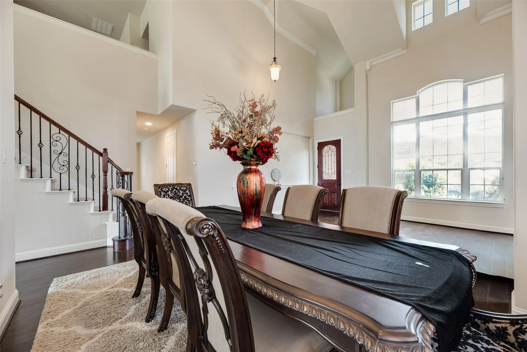 View of Dining room with view of living room in background and lots of natural light
