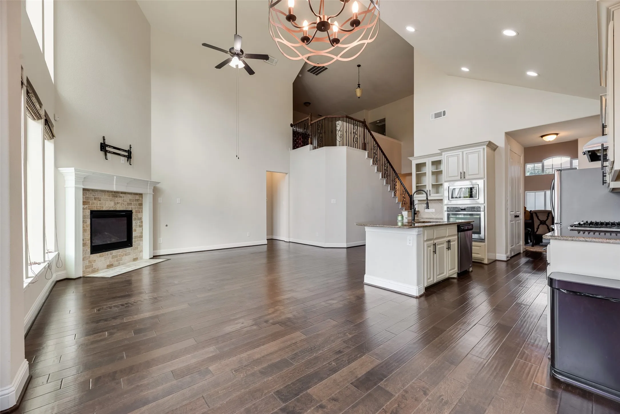 View of breakfast area, chef's kitchen and family living room.  Ready to make it your own.