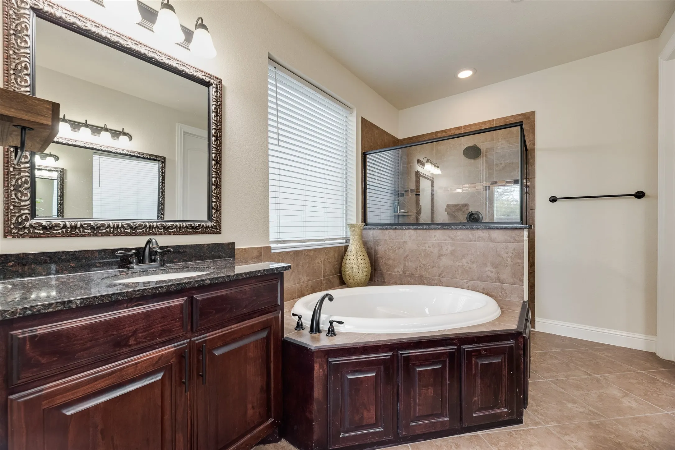 Another view of master bathroom with view of walk-in shower.