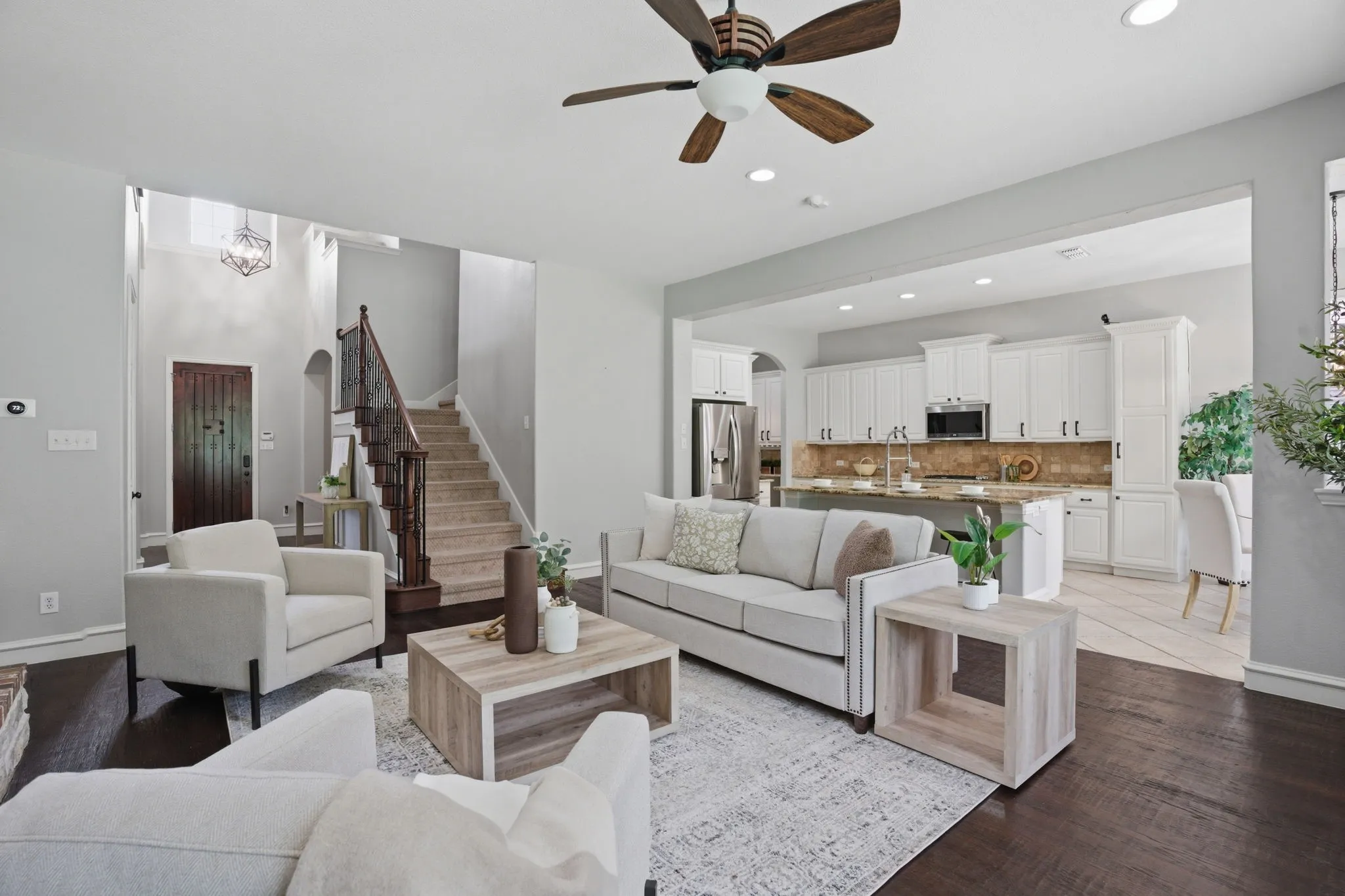 Open-concept living area with dark wood-finish flooring