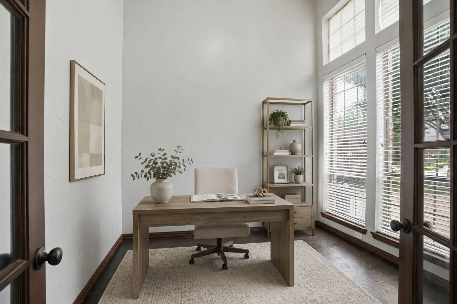 French doors open to a dedicated office with great lighting and high ceilings and rich dark flooring - virtually staged