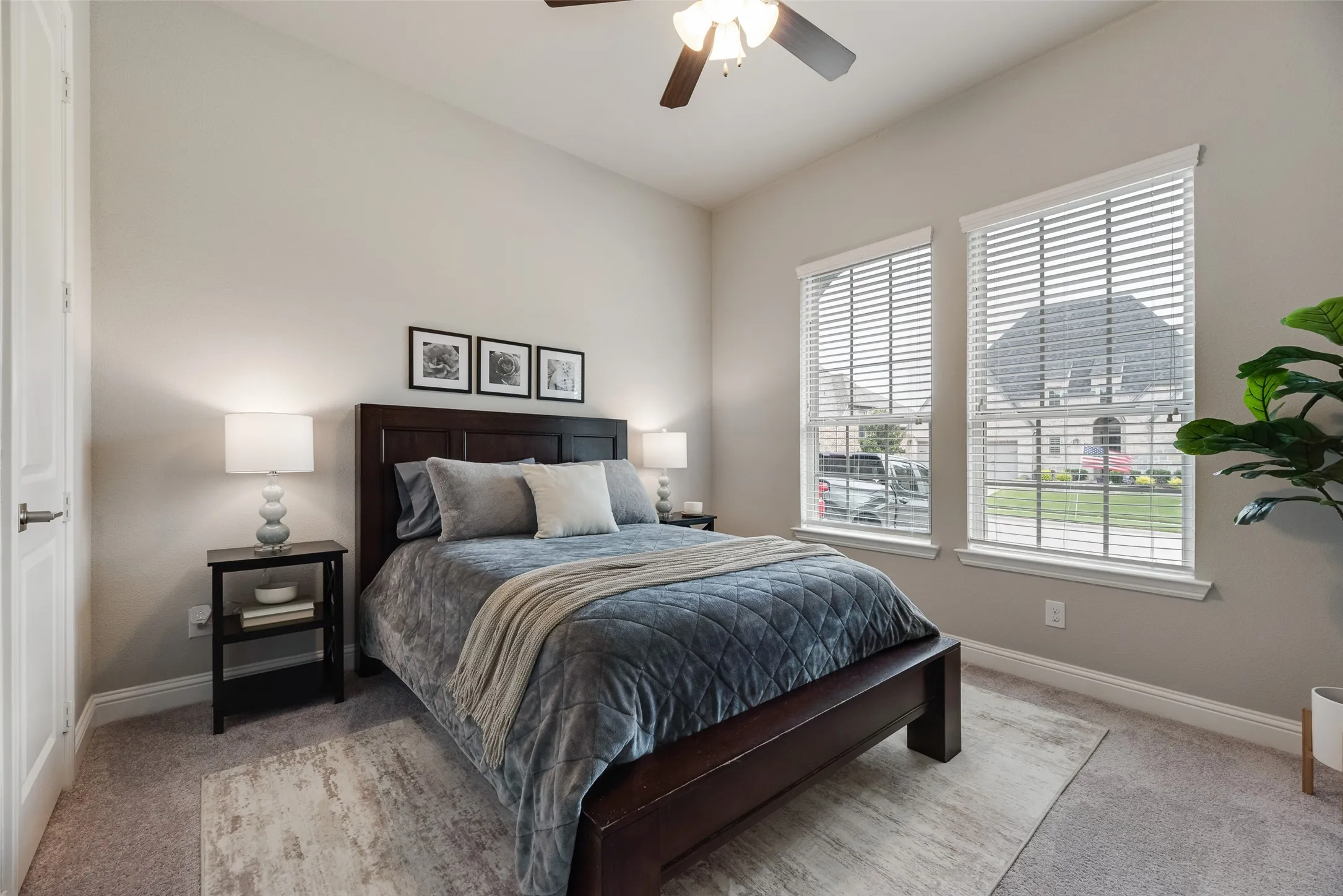 DOWNSTAIRS 2ND BEDROOM - Carpeted bedroom featuring light gray walls and a vaulted ceiling