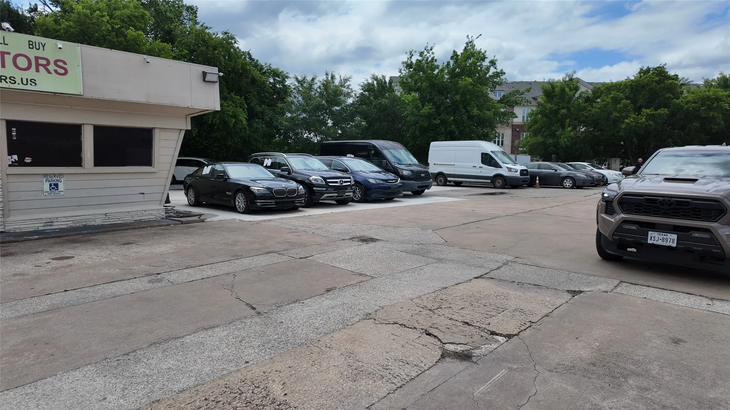 Commercial building featuring horizontal siding and a flat roofline