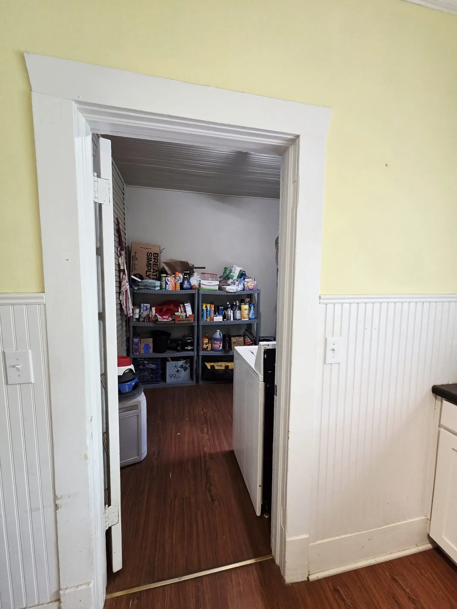Entryway with classic trim work and wood-finish flooring