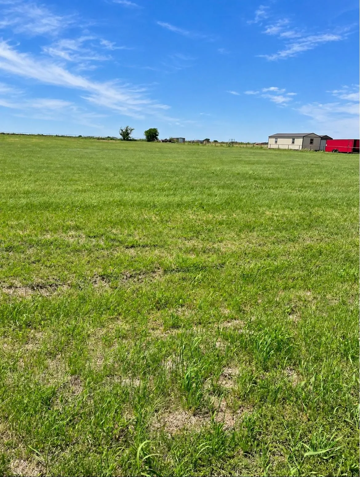 Expansive open land with a clear blue sky