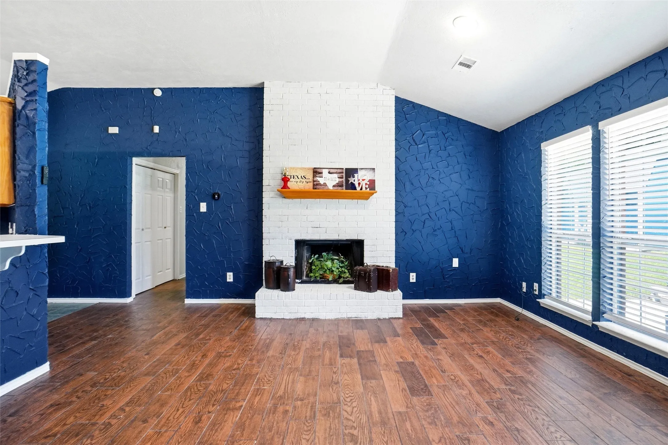 Living Area with Deep Fireplace Perfect to Keep You Warm During The Winter Months