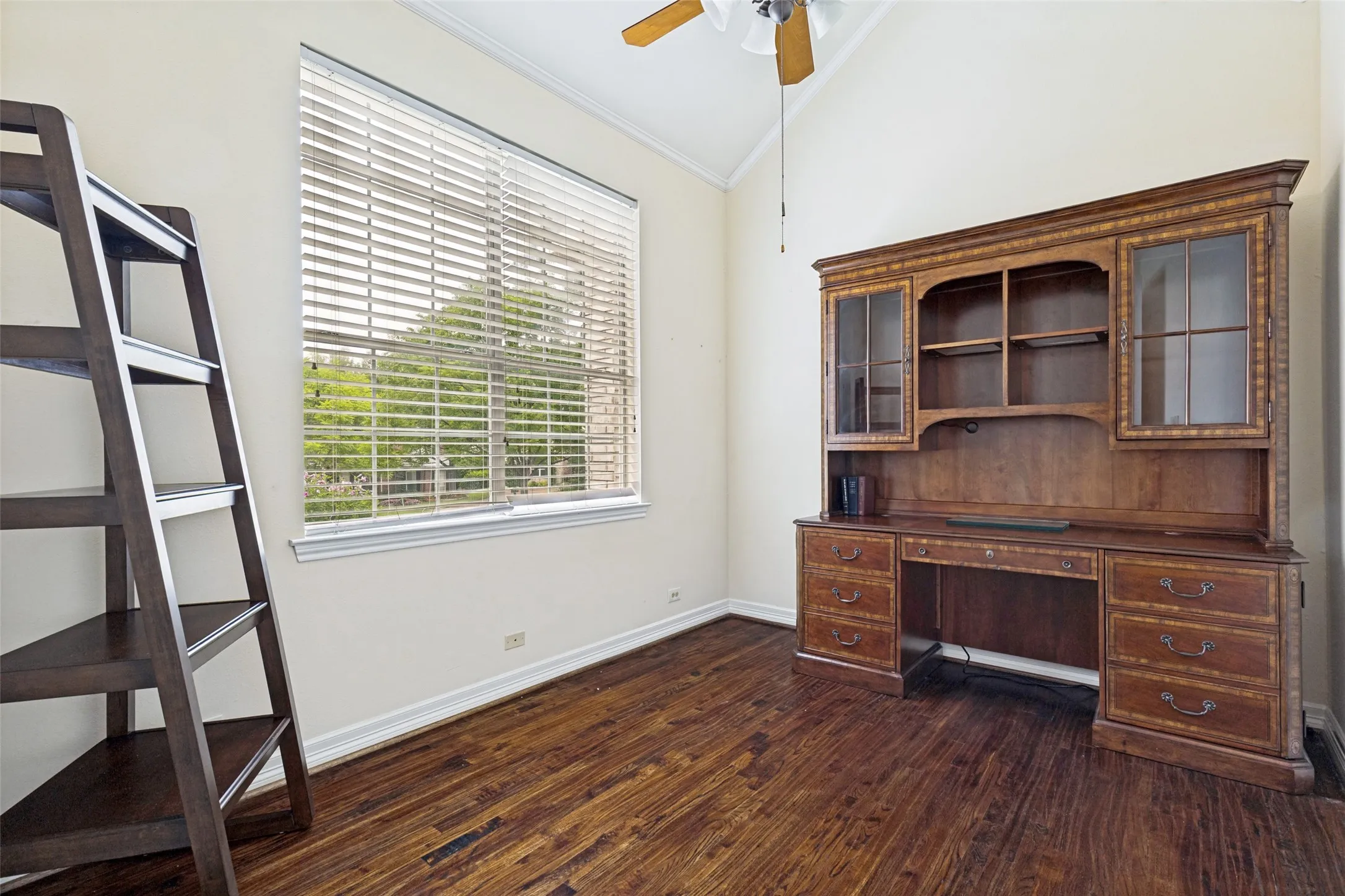 3rd Bedroom with hardwoods, cathedral cielings and split from the primary /2nd bedrooms. Full walk-in closet.