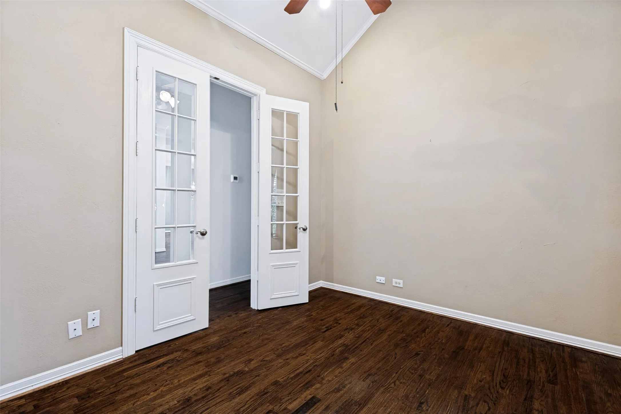 Located between the Primary and 2nd Bedrooms off a private hall way.
Double French doors with hardwood floors, could be a 4th bedroom.