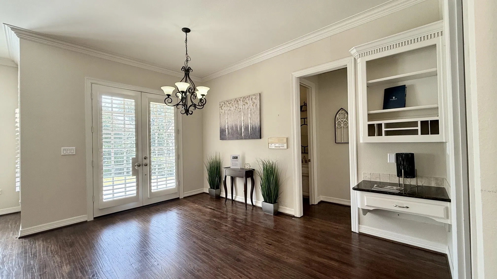 View: Casual dining. dbl doors to the covered patio, hall to the 3rd bedroom and full bathroom.